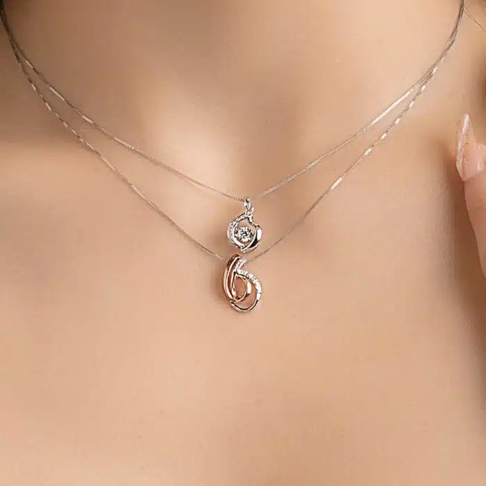 SK diamond necklace worn on a woman's neck alongside another necklace