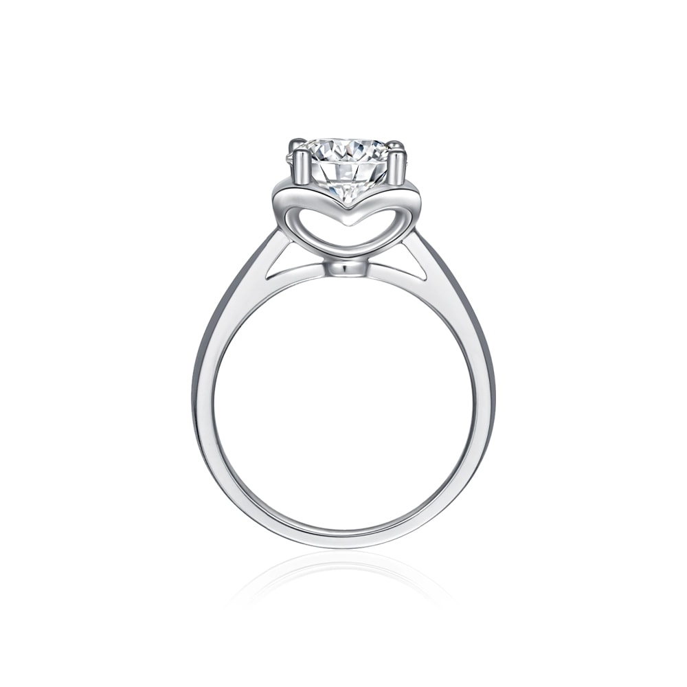 white gold engagement ring with heart shaped cathedral setting