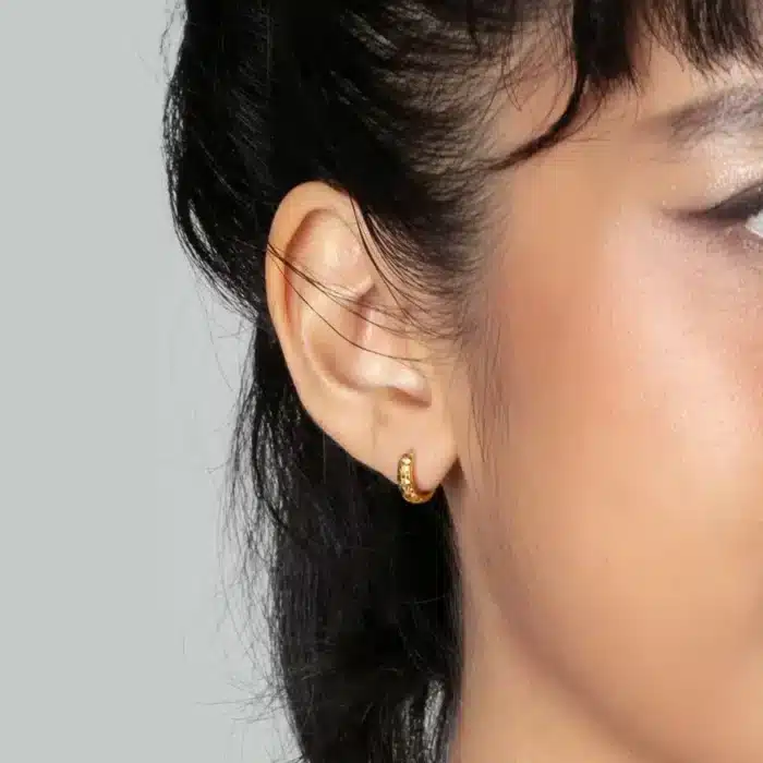 SK earrings malaysia woman wearing rounded hoops with texture design in 916 gold