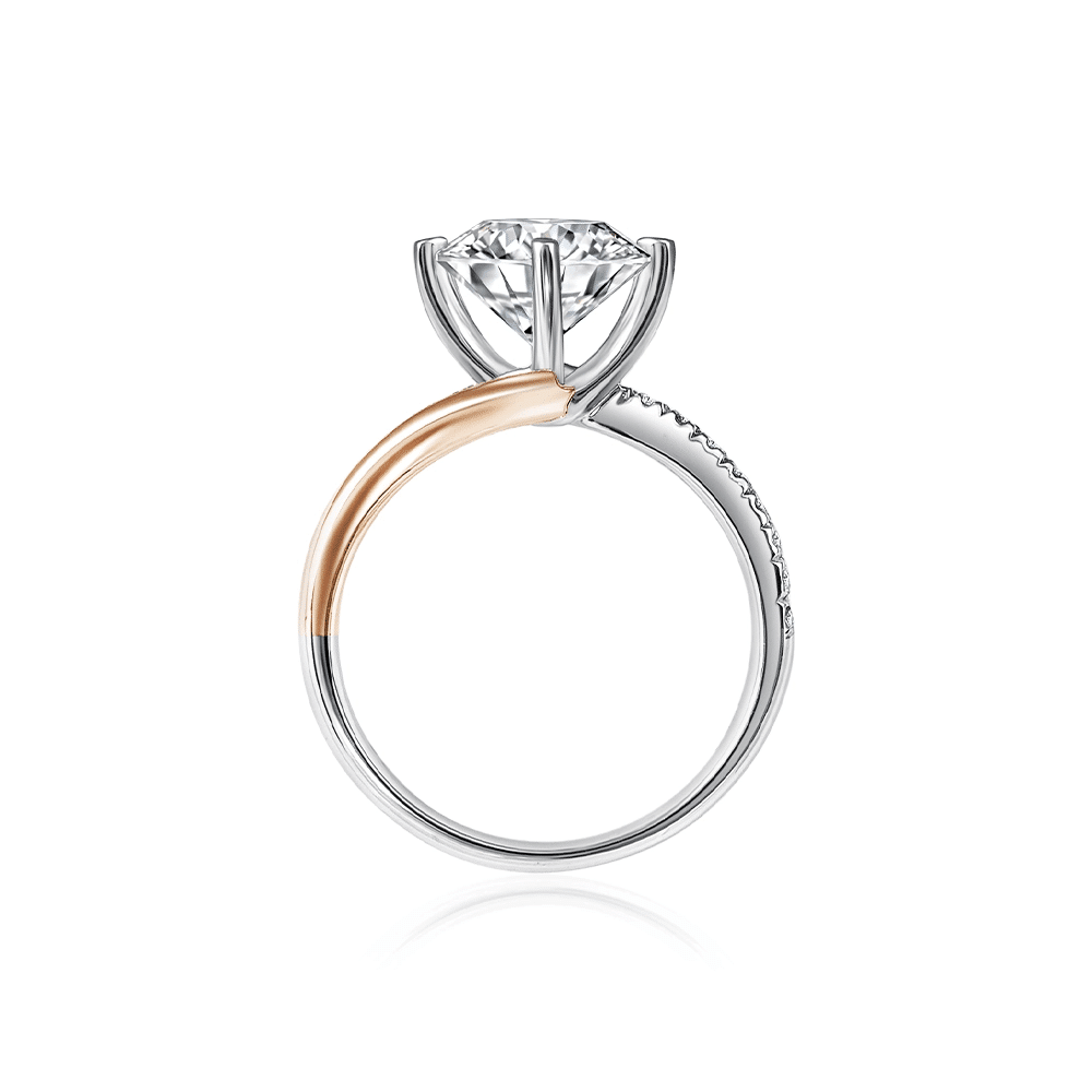 SK rose gold diamond ring with a twirl shaped pave band in 18k white gold and rose gold and 101 facets lab grown diamond viewed vertically