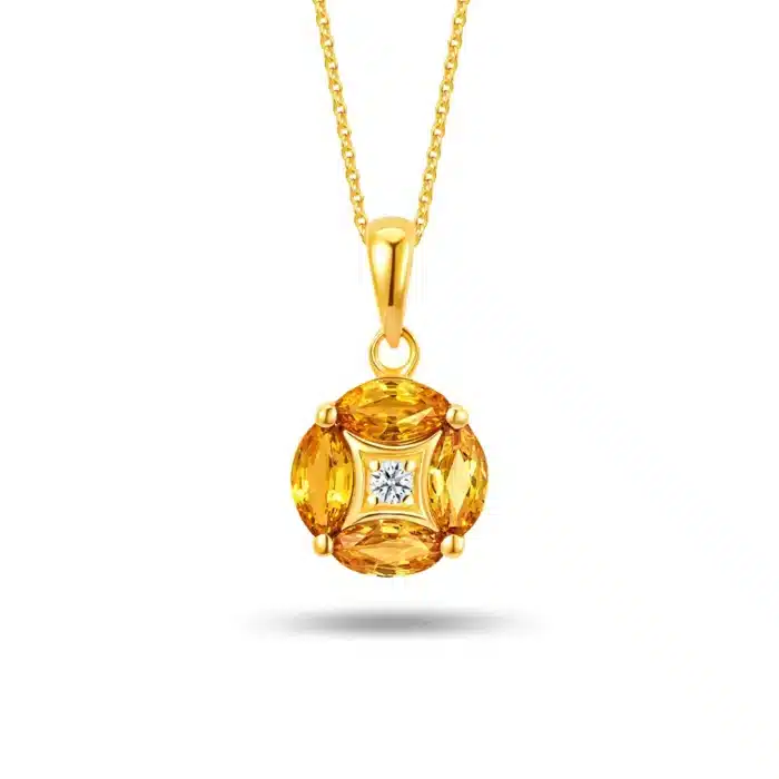 Dazzling Four Leaf 10k Gold Pendant Necklace for women featuring four oval-shaped yellow sapphires (0.69 carats) and a sparkling central diamond (0.02 carats) in a clover design with detachable 10k yellow gold chain.