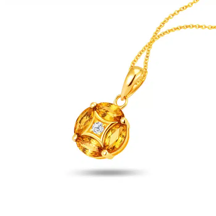 Dazzling Four Leaf 10k Gold Pendant Necklace for women featuring four oval-shaped yellow sapphires (0.69 carats) and a sparkling central diamond (0.02 carats) in a clover design with detachable 10k yellow gold chain.